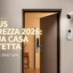 Immagine pubblicitaria per Bonus Sicurezza 2026 di Idea Elettrica: una porta blindata con serratura intelligente, videocamera di sorveglianza e videocitofono installati su una facciata di casa, con grate alle finestre. Scritta in sovraimpressione "BONUS SICUREZZA 2026: LA TUA CASA PROTETTA. DETRAZIONE IRPEF 50%